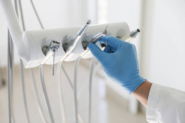 Professional Invisalign Clear Aligners technician working in Center Moriches, NY
